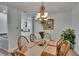 Charming dining room with chandelier and table for six is great for Gathering dinners at 10515 Canary Isle Dr, Tampa, FL 33647