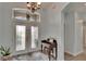 Bright foyer with a decorative chandelier, large front door, and a glimpse of the staircase at 10515 Canary Isle Dr, Tampa, FL 33647