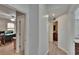 Hallway view with access to the office, bathroom, and living room at 10515 Canary Isle Dr, Tampa, FL 33647