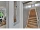 Hallway with staircase and doorway with a view of the living room at 10515 Canary Isle Dr, Tampa, FL 33647