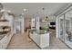 Bright kitchen features stainless appliances, custom cabinets, and oversized island with seating at 10515 Canary Isle Dr, Tampa, FL 33647