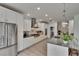Bright kitchen features stainless appliances, custom cabinets, and an oversized island at 10515 Canary Isle Dr, Tampa, FL 33647