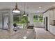 Bright kitchen features stainless appliances, custom cabinets, and oversized island with seating at 10515 Canary Isle Dr, Tampa, FL 33647