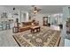 Open-concept living space featuring modern flooring and an adjacent kitchen and dining area at 10515 Canary Isle Dr, Tampa, FL 33647
