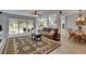 Open-concept living space with sliding glass doors, kitchen access, and adjacent dining area at 10515 Canary Isle Dr, Tampa, FL 33647