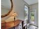 Close up view of a dresser, lamp and window in the main bedroom at 10515 Canary Isle Dr, Tampa, FL 33647