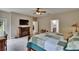 A fireplace sits opposite of the bed in the spacious main bedroom at 10515 Canary Isle Dr, Tampa, FL 33647