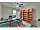 Office room with a granite desktop, office chairs, and a bookshelf at 10515 Canary Isle Dr, Tampa, FL 33647