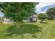The backyard offers a view of the home's screened patio at 11121 Cherrywood Ct, Spring Hill, FL 34609