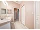 Bathroom with dual sink vanity, neutral walls, and tile floors at 11121 Cherrywood Ct, Spring Hill, FL 34609