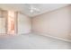 Bedroom featuring neutral walls, carpet, and a ceiling fan at 11121 Cherrywood Ct, Spring Hill, FL 34609