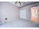 This bedroom has plush carpeting and a closet with bi-fold doors at 11121 Cherrywood Ct, Spring Hill, FL 34609