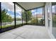 This is a screened patio with an unobstructed view of the outdoors at 11121 Cherrywood Ct, Spring Hill, FL 34609