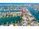 Aerial view of waterfront property with access to the Gulf, featuring a canal and nearby community at 11465 7Th E St, Treasure Island, FL 33706
