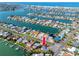 Aerial view of waterfront property with canal access and proximity to the Gulf, showcasing the home's location at 11465 7Th E St, Treasure Island, FL 33706