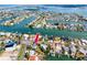 Waterfront home with canal access, lush landscaping and multiple boat slips at 11465 7Th E St, Treasure Island, FL 33706