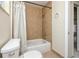 Small bath area featuring ceramic tiles in shower and floor, and shower head and curtain at 11465 7Th E St, Treasure Island, FL 33706