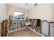 Bathroom in disrepair features a sink and tiled floor with exposed concrete block and wall studs at 11465 7Th E St, Treasure Island, FL 33706