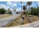 Charming single-story home with a well-manicured front yard and driveway at 11465 7Th E St, Treasure Island, FL 33706