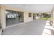 Large Florida room with tile floor, offering a light filled space with sliding doors to the exterior at 11465 7Th E St, Treasure Island, FL 33706