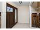 Foyer featuring a decorative front door and tile flooring, showcasing some interior remediation work at 11465 7Th E St, Treasure Island, FL 33706