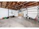 Garage interior showcases a large open space, exposed ceiling beams and storage potential at 11465 7Th E St, Treasure Island, FL 33706