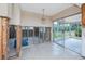 Bright kitchen with oak cabinets, sliding glass doors to a sunroom, and unfinished walls at 11465 7Th E St, Treasure Island, FL 33706