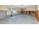 Bright living room with a large window, unfinished walls, and a concrete floor, awaiting personalization at 11465 7Th E St, Treasure Island, FL 33706