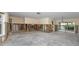 Open living room with unfinished walls, sliding glass doors to a patio, and views of the water at 11465 7Th E St, Treasure Island, FL 33706