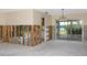 Spacious living room with unfinished walls, sliding glass doors to the water, and neutral tones at 11465 7Th E St, Treasure Island, FL 33706