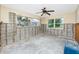 Spacious room featuring windows providing natural light, and partially exposed concrete block and wall structure at 11465 7Th E St, Treasure Island, FL 33706