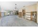 Open-concept living area with partially exposed wall structure, featuring bright light, and views of other rooms at 11465 7Th E St, Treasure Island, FL 33706