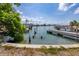 View of a waterfront canal with docks and boats, highlighting the home's access to boating and water activities at 11465 7Th E St, Treasure Island, FL 33706
