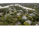 Stunning aerial view of a waterfront community nestled among lush trees and calm waterways at 12 Bayou Ln, Palm Harbor, FL 34683