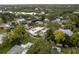 Gorgeous aerial shot of home with boat dock nestled among trees on the waterfront at 12 Bayou Ln, Palm Harbor, FL 34683
