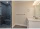 Modern bathroom with a glass-enclosed shower featuring stylish tilework and a vanity with counter space at 12 Bayou Ln, Palm Harbor, FL 34683