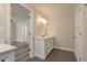 Bathroom featuring a vanity with drawers, and an open doorway to the rest of the home at 12 Bayou Ln, Palm Harbor, FL 34683