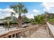Private dock with scenic water views and lush tropical landscaping at 12 Bayou Ln, Palm Harbor, FL 34683