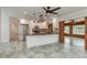 Modern kitchen with stainless steel appliances, a breakfast bar, and an open layout at 12 Bayou Ln, Palm Harbor, FL 34683