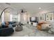 Comfortable living room with a modern sofa and ample natural light through the large window at 12 Bayou Ln, Palm Harbor, FL 34683