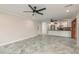 Bright living area showcasing a spacious layout, tiled floors, and seamless kitchen integration at 12 Bayou Ln, Palm Harbor, FL 34683