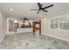 Open-concept living space flowing into a modern kitchen with stainless steel appliances at 12 Bayou Ln, Palm Harbor, FL 34683