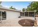 Outdoor patio area connects the deck and screened porch, perfect for entertaining at 12 Bayou Ln, Palm Harbor, FL 34683