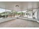 Large screened porch offers stunning waterfront views and outdoor living space at 12 Bayou Ln, Palm Harbor, FL 34683