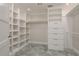Well-organized walk-in closet with shelving and drawers, providing ample storage space at 12 Bayou Ln, Palm Harbor, FL 34683
