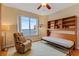 Bedroom with scenic water view and convertible bed with shelving at 1200 Gulf Blvd # 1704, Clearwater Beach, FL 33767