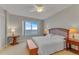 This bright bedroom features a large window with an ocean view and traditional furnishings at 1200 Gulf Blvd # 1704, Clearwater Beach, FL 33767