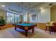 Inviting game room with a classic pool table, pendant lighting, and comfortable seating at 1200 Gulf Blvd # 1704, Clearwater Beach, FL 33767