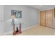 Elegant hallway with tile flooring, artwork, and a stylish glass-topped table at 1200 Gulf Blvd # 1704, Clearwater Beach, FL 33767