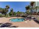 Enjoy this outdoor hot tub with brick surround, steps, and handrail, surrounded by tropical landscaping and palm trees at 1200 Gulf Blvd # 1704, Clearwater Beach, FL 33767
